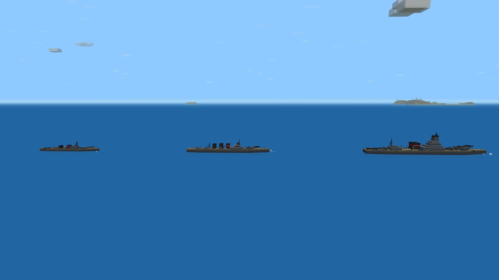 Three blocky warships abreast on open water for scale: a small destroyer, a larger cruiser, and a long broad battleship with multiple gun turrets and a tall bridge tower
